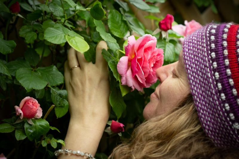 Ellen smelling a rose